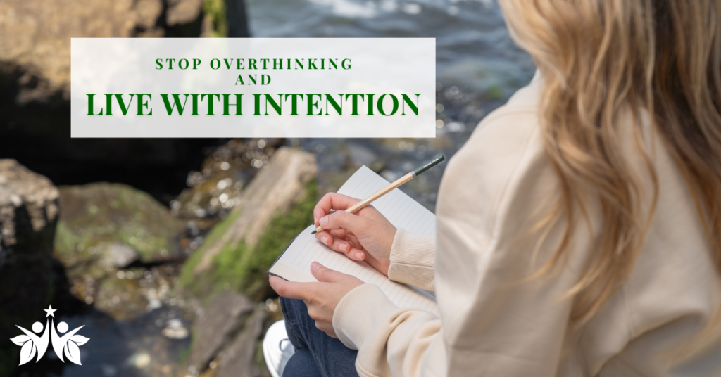 A woman with long hair sitting by the water, journaling with a notebook and pencil. The text overlay reads 'Stop Overthinking and Live with Intention,' promoting mindfulness, balance, and self-reflection.