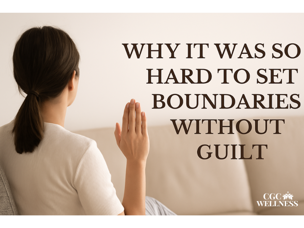 A woman with dark brown hair sits on a light gray couch, facing away, her hand raised gently in a boundary-setting gesture. The warm, soft-lit room reflects personal strength, emotional clarity, and the journey of learning to say no without guilt.